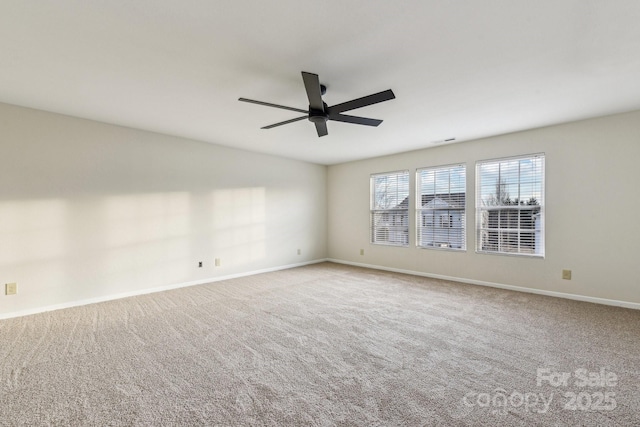 empty room with light carpet and ceiling fan