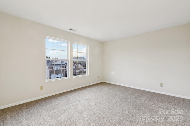 spare room featuring carpet floors