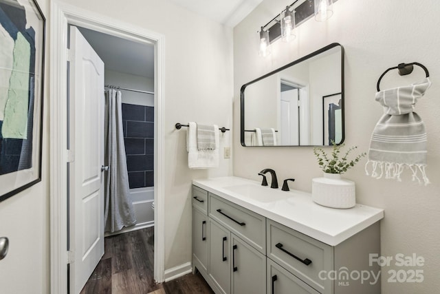 bathroom with shower / bath combination with curtain, vanity, and hardwood / wood-style floors