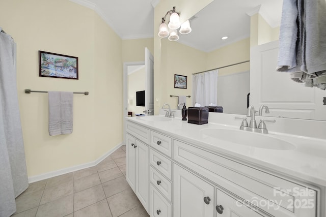 bathroom featuring ornamental molding, tile patterned floors, and vanity