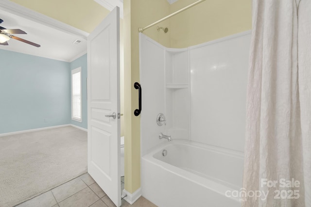 bathroom featuring tile patterned flooring, shower / tub combo, and ceiling fan