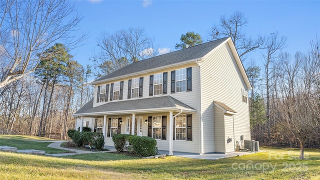 view of front of property featuring cooling unit, a porch, and a front lawn