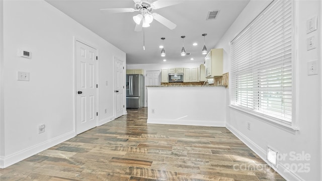 unfurnished living room with hardwood / wood-style floors and ceiling fan