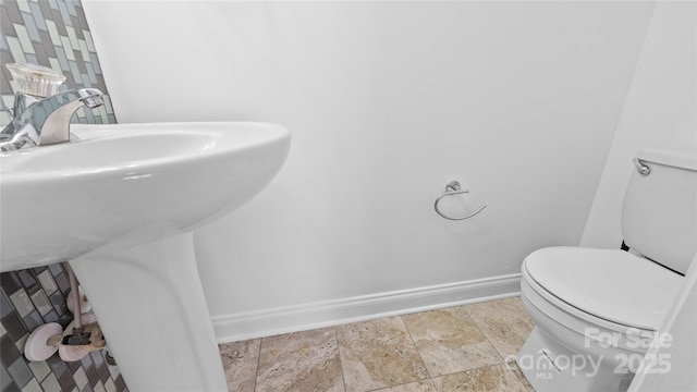 bathroom featuring sink and toilet