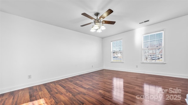 empty room featuring wood-type flooring and ceiling fan