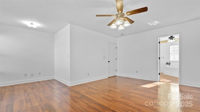 spare room featuring hardwood / wood-style floors and ceiling fan