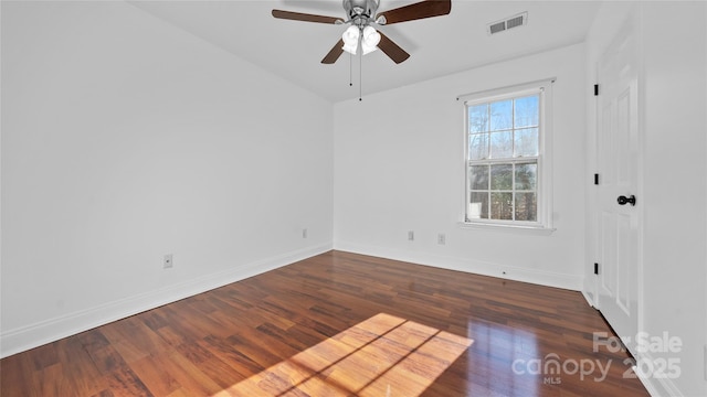 unfurnished room with dark hardwood / wood-style floors and ceiling fan