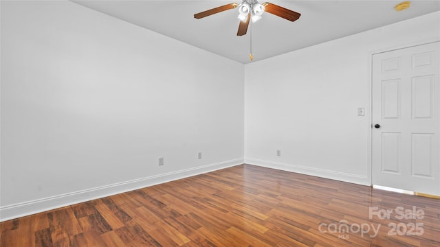 spare room featuring hardwood / wood-style flooring and ceiling fan