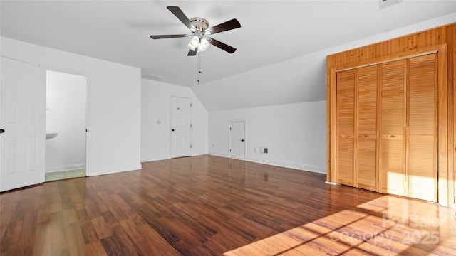 additional living space with lofted ceiling, hardwood / wood-style floors, and ceiling fan