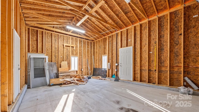 miscellaneous room featuring high vaulted ceiling