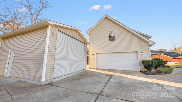 view of side of home with a garage