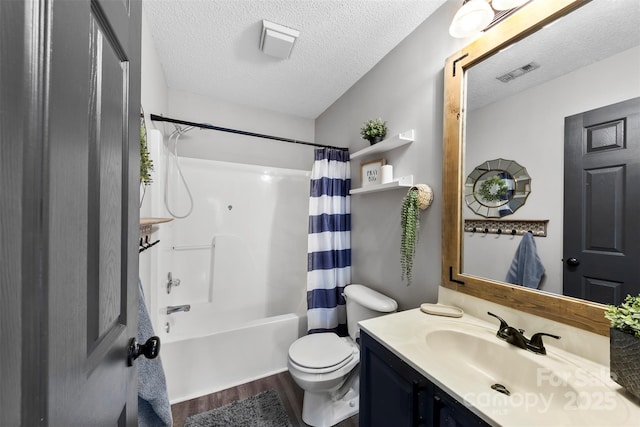 full bathroom featuring toilet, wood-type flooring, a textured ceiling, vanity, and shower / bathtub combination with curtain