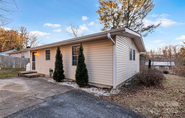 view of side of home featuring a patio