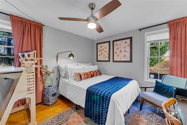 bedroom featuring hardwood / wood-style flooring and ceiling fan