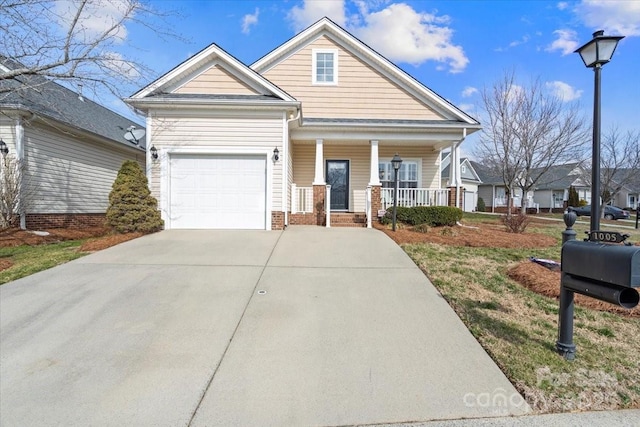 view of front of property with a garage and a porch