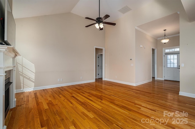 unfurnished living room featuring crown molding, ceiling fan, high vaulted ceiling, and light hardwood / wood-style flooring