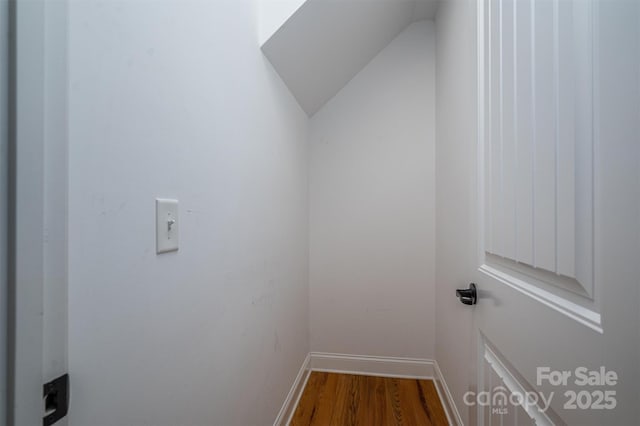 interior space with lofted ceiling and hardwood / wood-style floors