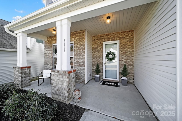 doorway to property with a porch