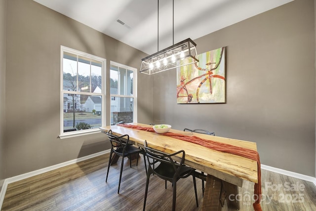 dining room featuring dark wood-type flooring