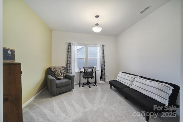 sitting room featuring light carpet