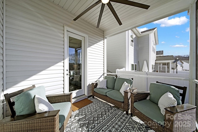 balcony featuring an outdoor living space and ceiling fan