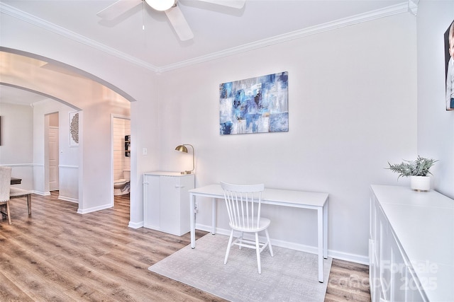 office with ceiling fan, ornamental molding, and light hardwood / wood-style flooring