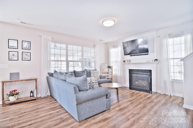 living room with light hardwood / wood-style flooring