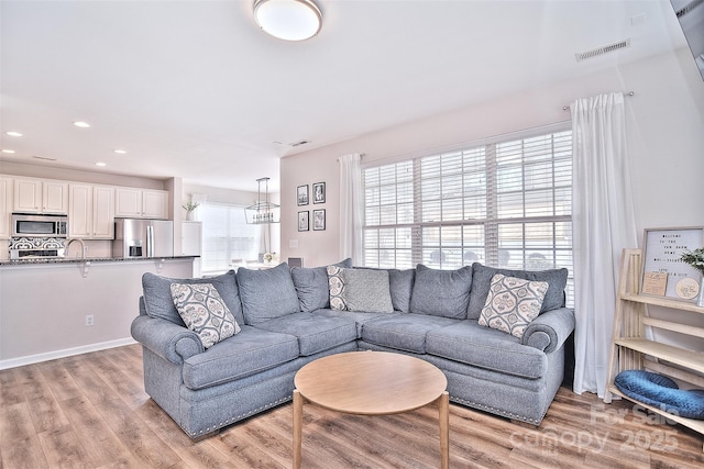 living room with light hardwood / wood-style floors