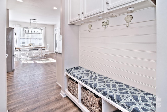 mudroom with wood-type flooring