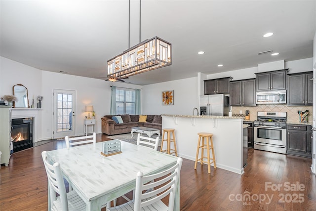 dining room with dark wood-type flooring