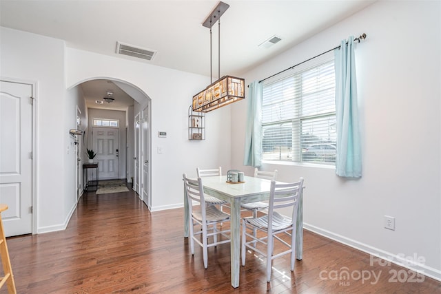 dining room featuring dark wood-type flooring