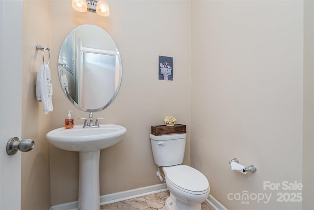 bathroom featuring sink and toilet