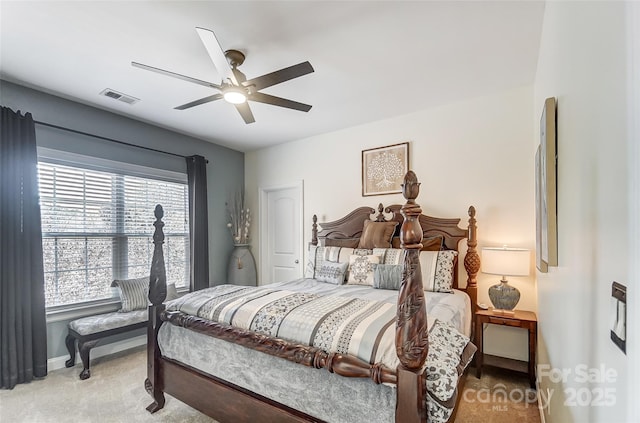 bedroom with ceiling fan and carpet flooring