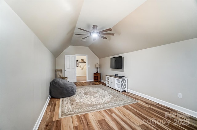 interior space featuring lofted ceiling, hardwood / wood-style floors, and ceiling fan