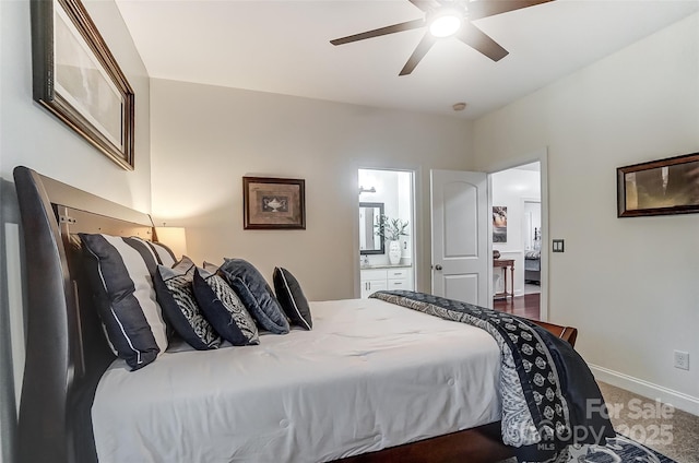 bedroom featuring ensuite bath and ceiling fan