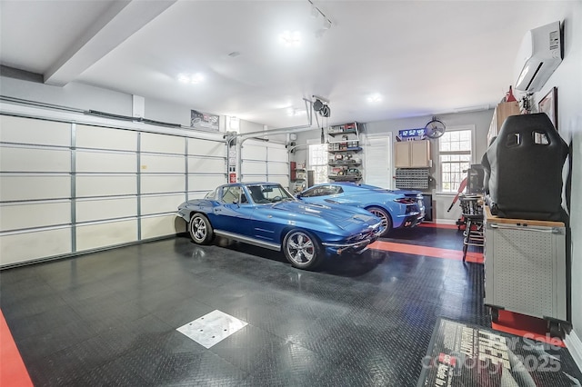 garage featuring a wall mounted AC