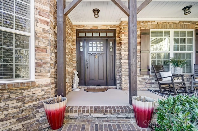 doorway to property featuring a porch