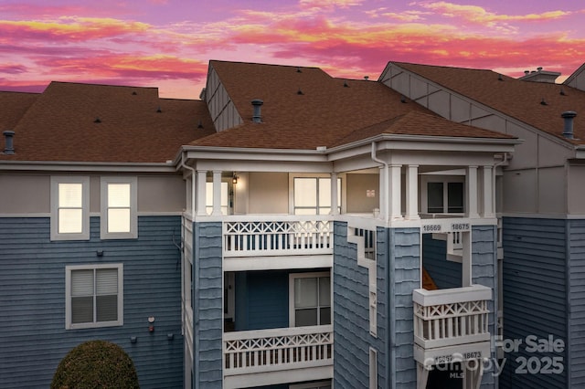 view of outdoor building at dusk