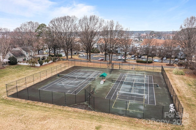 view of sport court featuring a lawn