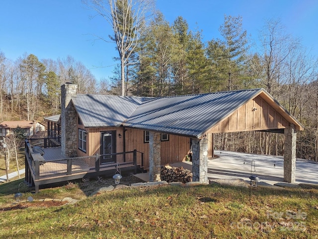 back of property with a wooden deck