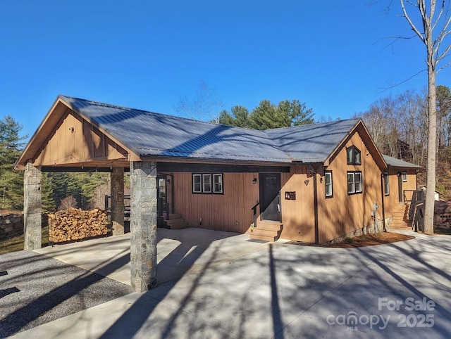 600 Pinewood Dr, Waynesville, NC 28786 - chalet / cabin with entry steps, metal roof, and stone siding