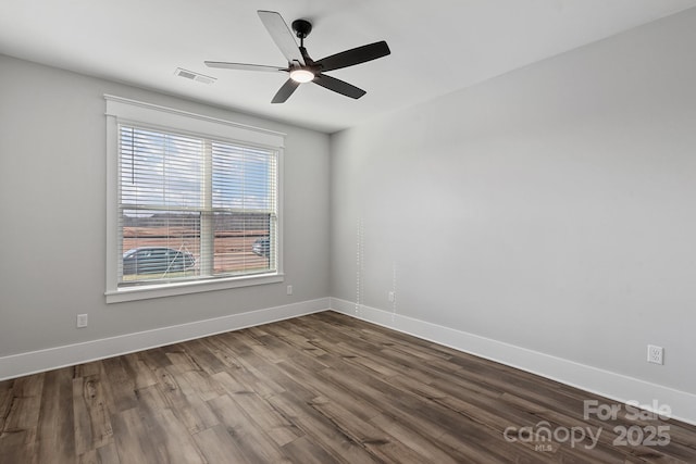 empty room with hardwood / wood-style flooring and ceiling fan