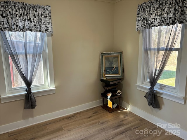 unfurnished room featuring light wood-type flooring