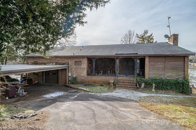 view of front of home featuring a carport