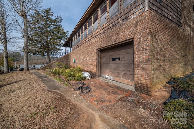 view of side of property with a garage