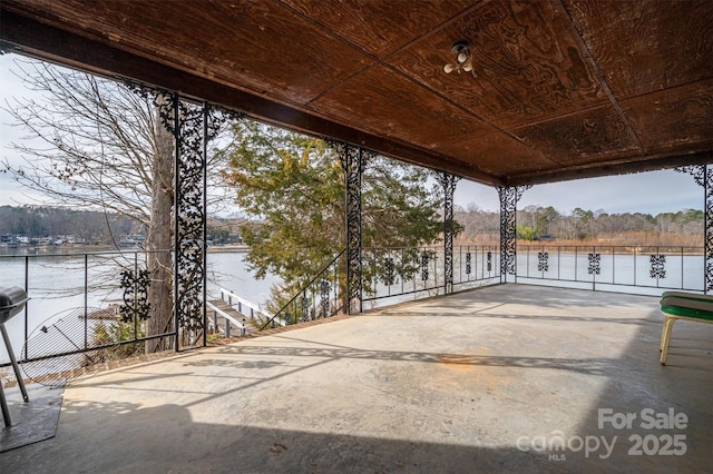 view of patio featuring a water view