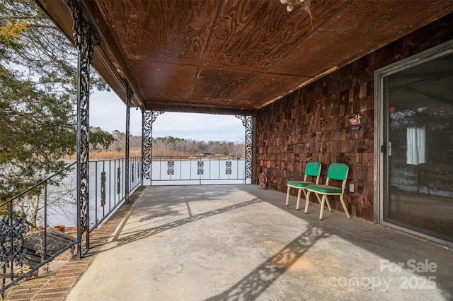 view of patio featuring a water view