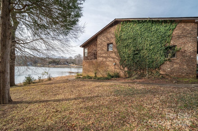 view of property exterior featuring a water view