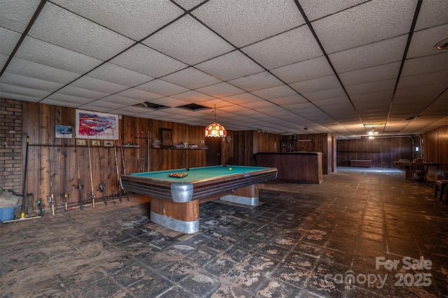 rec room with billiards, wooden walls, and a drop ceiling