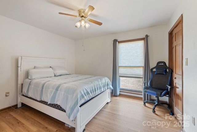 bedroom featuring light hardwood / wood-style flooring and ceiling fan